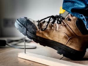 man stepping on rusty nail